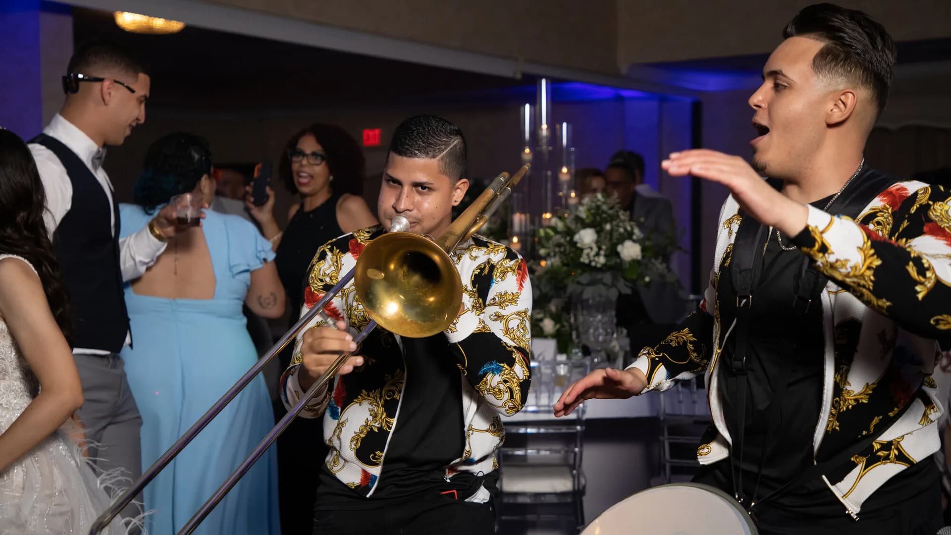 Batucada musicians with a trombone energizing wedding guests