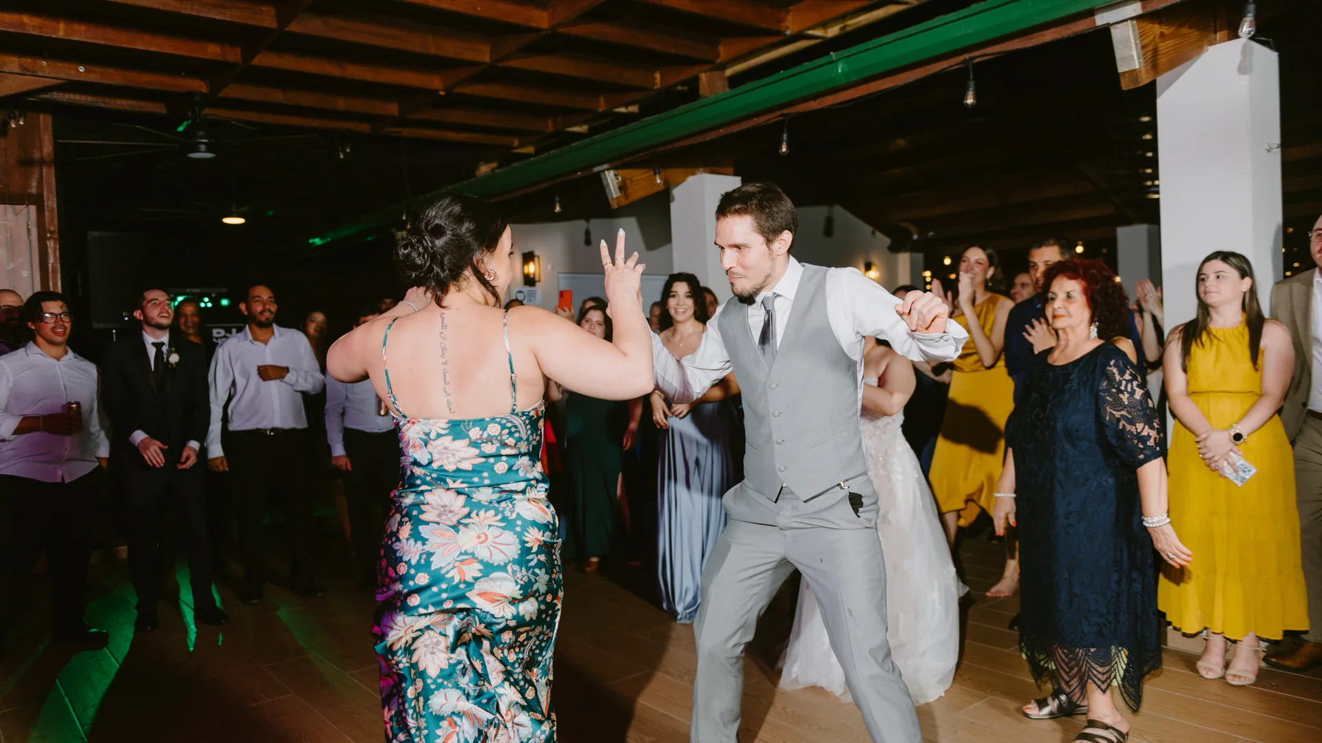 Guests dancing on a wedding reception dance floor